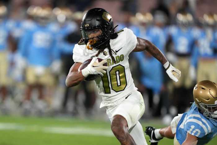 Colorado Buffaloes wide receiver Xavier Weaver (10) carries the ball against the UCLA Bruins in the second half at Rose Bowl. UCLA defeated Colorado 28-16